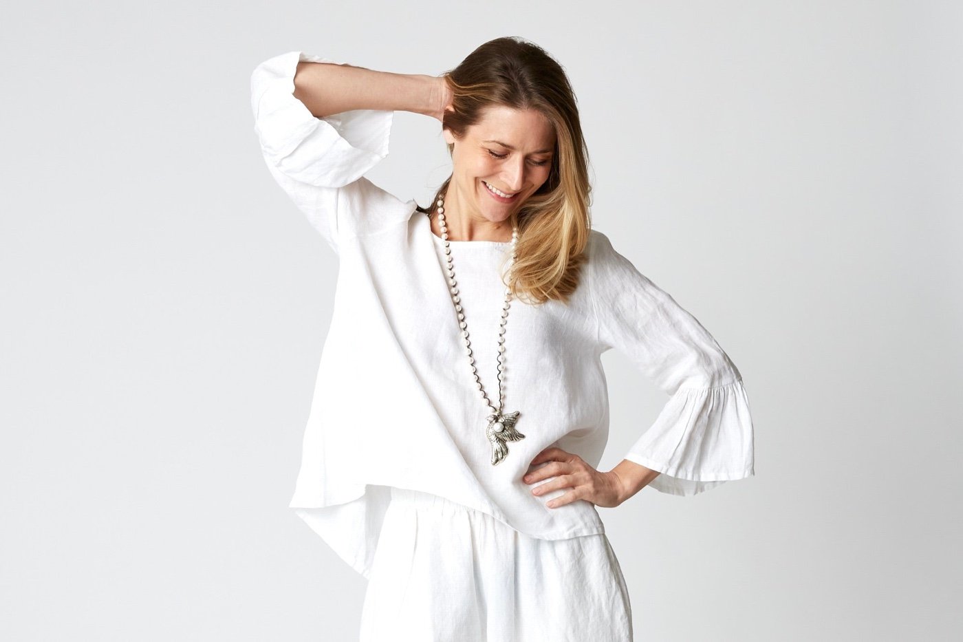 Woman wearing a white Bryn Walker outfit