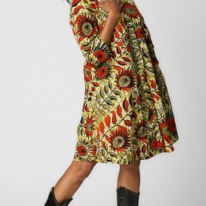 Model wearing Sunflowers Zuri Dress with black leather boots.