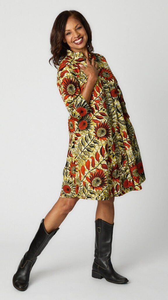 Model wearing Sunflowers Zuri Dress with black leather boots.